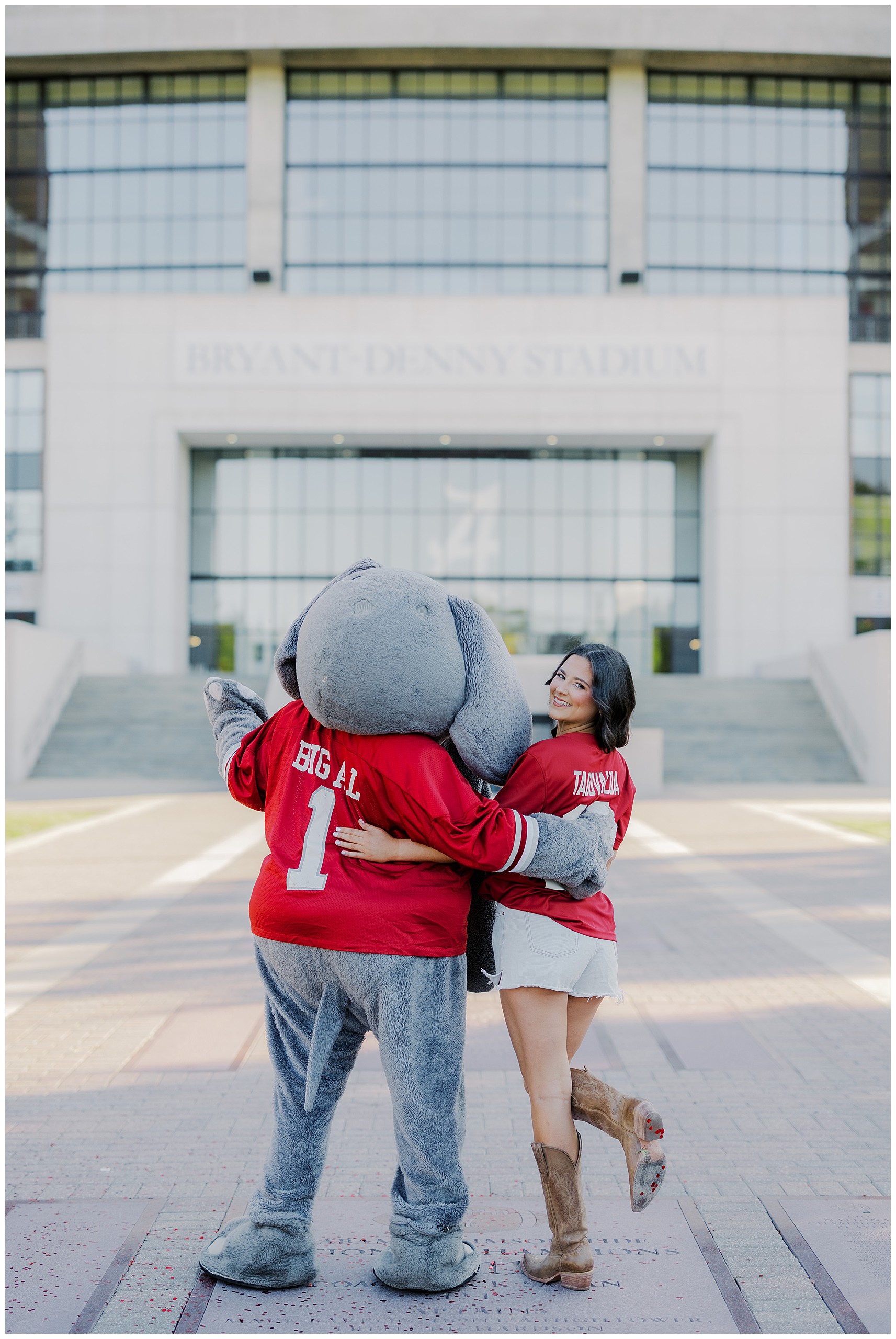 Graduate posing with Big Al at Bryant-Denny Stadium